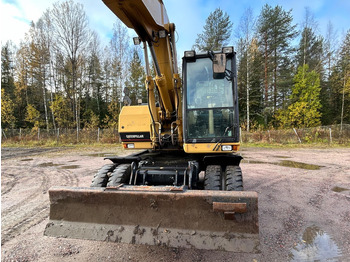 Bager na kotačima Caterpillar M312 Engcon EC20 tiltrotator: slika Bager na kotačima Caterpillar M312 Engcon EC20 tiltrotator Bager na kotačima Caterpillar M312 Engcon EC20 tiltrotator: slika Bager na kotačima Caterpillar M312 Engcon EC20 tiltrotator