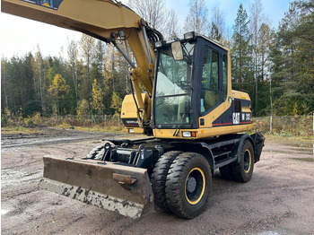 Bager na kotačima Caterpillar M312 Engcon EC20 tiltrotator: slika Bager na kotačima Caterpillar M312 Engcon EC20 tiltrotator Bager na kotačima Caterpillar M312 Engcon EC20 tiltrotator: slika Bager na kotačima Caterpillar M312 Engcon EC20 tiltrotator