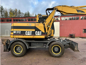 Bager na kotačima Caterpillar M312 Engcon EC20 tiltrotator: slika Bager na kotačima Caterpillar M312 Engcon EC20 tiltrotator Bager na kotačima Caterpillar M312 Engcon EC20 tiltrotator: slika Bager na kotačima Caterpillar M312 Engcon EC20 tiltrotator