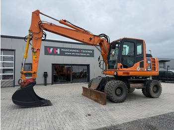 Bager na kotačima KOMATSU PW148-8