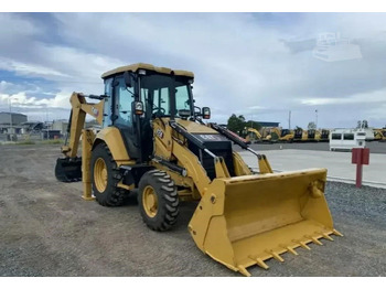 Rovokopač-utovarivač CATERPILLAR