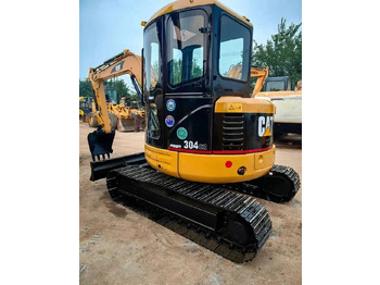 Mini bager CATERPILLAR