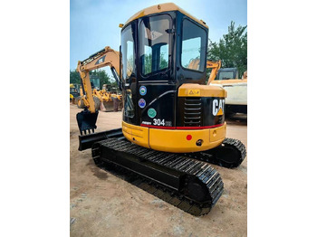 Mini bager CATERPILLAR