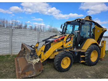 Rovokopač-utovarivač CATERPILLAR