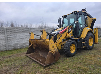 Rovokopač-utovarivač CATERPILLAR