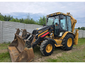 Rovokopač-utovarivač CATERPILLAR