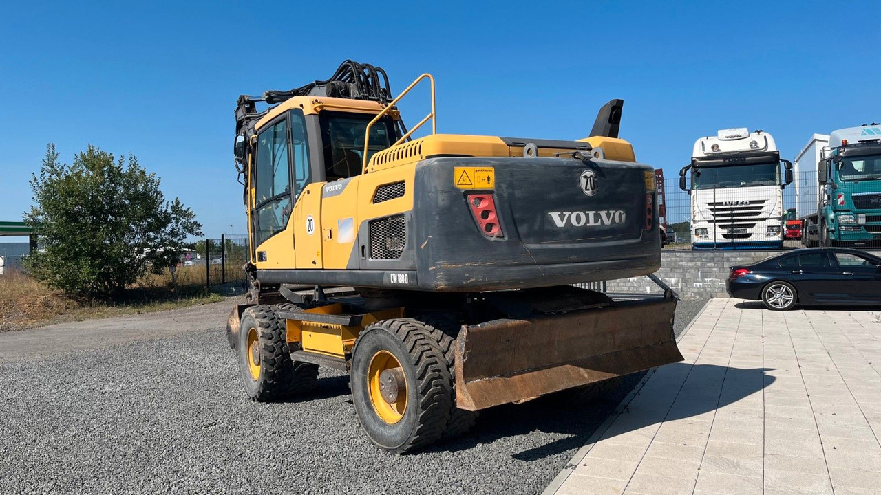 Volvo EW180D 20500 Kg Verstellausleger OilQuick - Bager na kotačima: slika Volvo EW180D 20500 Kg Verstellausleger OilQuick - Bager na kotačima Volvo EW180D 20500 Kg Verstellausleger OilQuick - Bager na kotačima: slika Volvo EW180D 20500 Kg Verstellausleger OilQuick - Bager na kotačima