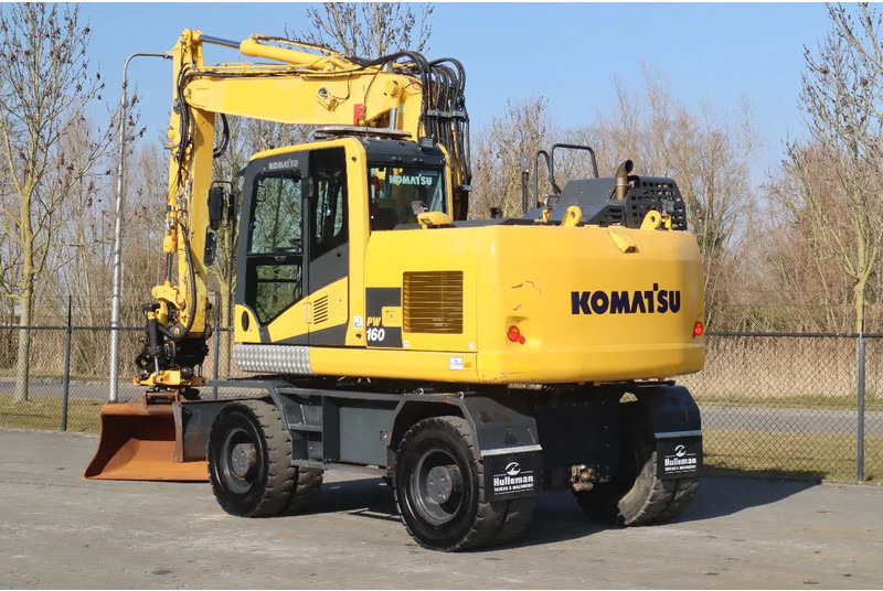 Komatsu PW160-11 | ENGCON TILTROTATOR | BUCKET | TRAILER HYDR. - Bager na kotačima: slika Komatsu PW160-11 | ENGCON TILTROTATOR | BUCKET | TRAILER HYDR. - Bager na kotačima Komatsu PW160-11 | ENGCON TILTROTATOR | BUCKET | TRAILER HYDR. - Bager na kotačima: slika Komatsu PW160-11 | ENGCON TILTROTATOR | BUCKET | TRAILER HYDR. - Bager na kotačima