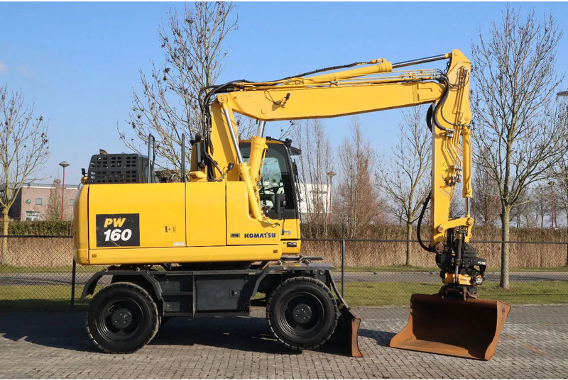 Komatsu PW160-11 | ENGCON TILTROTATOR | BUCKET | TRAILER HYDR. - Bager na kotačima: slika Komatsu PW160-11 | ENGCON TILTROTATOR | BUCKET | TRAILER HYDR. - Bager na kotačima Komatsu PW160-11 | ENGCON TILTROTATOR | BUCKET | TRAILER HYDR. - Bager na kotačima: slika Komatsu PW160-11 | ENGCON TILTROTATOR | BUCKET | TRAILER HYDR. - Bager na kotačima