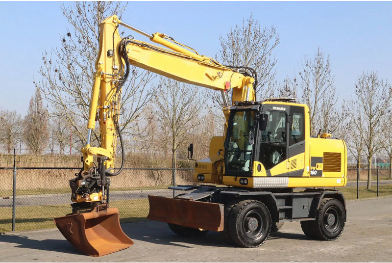 Komatsu PW160-11 | ENGCON TILTROTATOR | BUCKET | TRAILER HYDR. - Bager na kotačima: slika Komatsu PW160-11 | ENGCON TILTROTATOR | BUCKET | TRAILER HYDR. - Bager na kotačima Komatsu PW160-11 | ENGCON TILTROTATOR | BUCKET | TRAILER HYDR. - Bager na kotačima: slika Komatsu PW160-11 | ENGCON TILTROTATOR | BUCKET | TRAILER HYDR. - Bager na kotačima