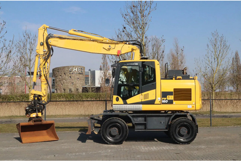 Komatsu PW160-11 | ENGCON TILTROTATOR | BUCKET | TRAILER HYDR. - Bager na kotačima: slika Komatsu PW160-11 | ENGCON TILTROTATOR | BUCKET | TRAILER HYDR. - Bager na kotačima Komatsu PW160-11 | ENGCON TILTROTATOR | BUCKET | TRAILER HYDR. - Bager na kotačima: slika Komatsu PW160-11 | ENGCON TILTROTATOR | BUCKET | TRAILER HYDR. - Bager na kotačima