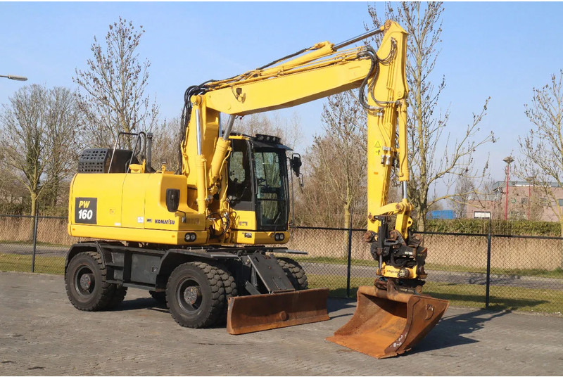 Komatsu PW160-11 | ENGCON TILTROTATOR | BUCKET | TRAILER HYDR. - Bager na kotačima: slika Komatsu PW160-11 | ENGCON TILTROTATOR | BUCKET | TRAILER HYDR. - Bager na kotačima Komatsu PW160-11 | ENGCON TILTROTATOR | BUCKET | TRAILER HYDR. - Bager na kotačima: slika Komatsu PW160-11 | ENGCON TILTROTATOR | BUCKET | TRAILER HYDR. - Bager na kotačima