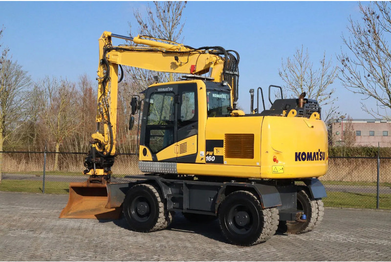 Komatsu PW160-11 | ENGCON TILTROTATOR | BUCKET | TRAILER HYDR. - Bager na kotačima: slika Komatsu PW160-11 | ENGCON TILTROTATOR | BUCKET | TRAILER HYDR. - Bager na kotačima Komatsu PW160-11 | ENGCON TILTROTATOR | BUCKET | TRAILER HYDR. - Bager na kotačima: slika Komatsu PW160-11 | ENGCON TILTROTATOR | BUCKET | TRAILER HYDR. - Bager na kotačima