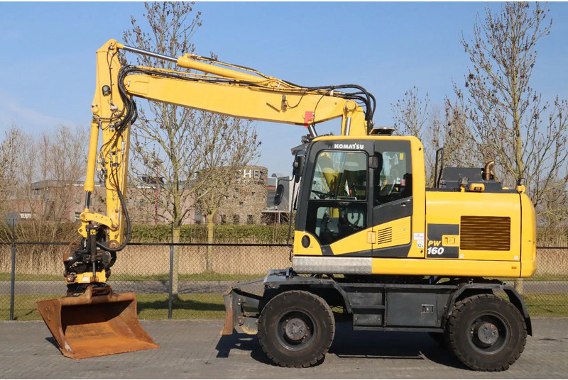 Komatsu PW160-11 | ENGCON TILTROTATOR | BUCKET | TRAILER HYDR. - Bager na kotačima: slika Komatsu PW160-11 | ENGCON TILTROTATOR | BUCKET | TRAILER HYDR. - Bager na kotačima Komatsu PW160-11 | ENGCON TILTROTATOR | BUCKET | TRAILER HYDR. - Bager na kotačima: slika Komatsu PW160-11 | ENGCON TILTROTATOR | BUCKET | TRAILER HYDR. - Bager na kotačima