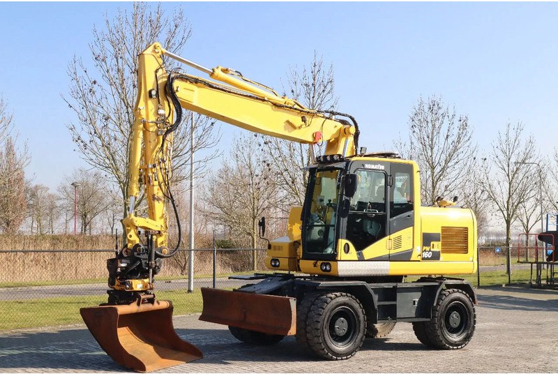 Komatsu PW160-11 | ENGCON TILTROTATOR | BUCKET | TRAILER HYDR. - Bager na kotačima: slika Komatsu PW160-11 | ENGCON TILTROTATOR | BUCKET | TRAILER HYDR. - Bager na kotačima Komatsu PW160-11 | ENGCON TILTROTATOR | BUCKET | TRAILER HYDR. - Bager na kotačima: slika Komatsu PW160-11 | ENGCON TILTROTATOR | BUCKET | TRAILER HYDR. - Bager na kotačima