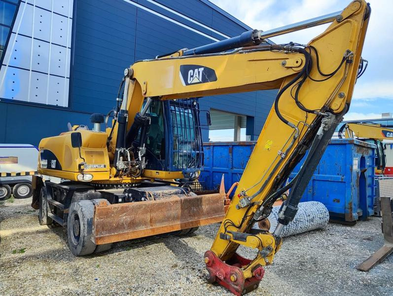 Caterpillar M318D MH - Bager na kotačima: slika Caterpillar M318D MH - Bager na kotačima Caterpillar M318D MH - Bager na kotačima: slika Caterpillar M318D MH - Bager na kotačima