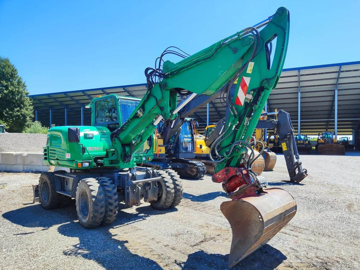 Takeuchi TB295W - Bager na kotačima: slika Takeuchi TB295W - Bager na kotačima Takeuchi TB295W - Bager na kotačima: slika Takeuchi TB295W - Bager na kotačima