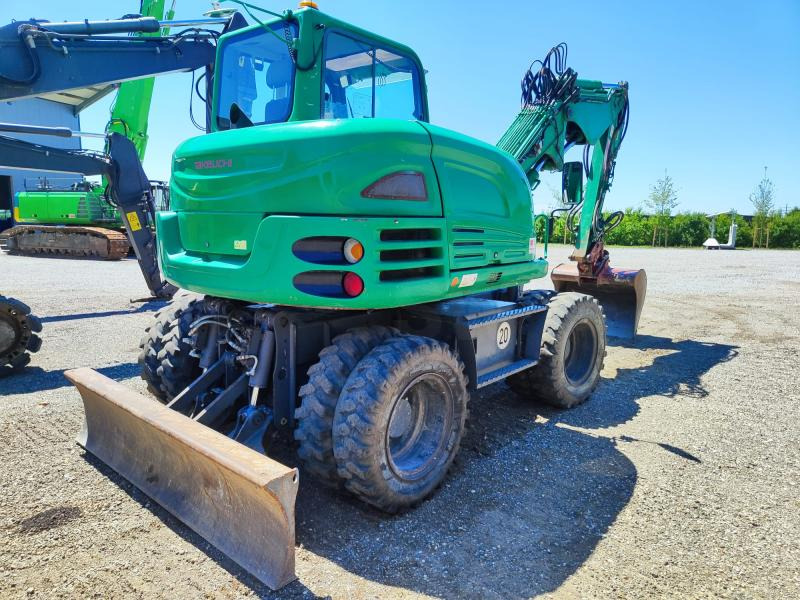Takeuchi TB295W - Bager na kotačima: slika Takeuchi TB295W - Bager na kotačima Takeuchi TB295W - Bager na kotačima: slika Takeuchi TB295W - Bager na kotačima