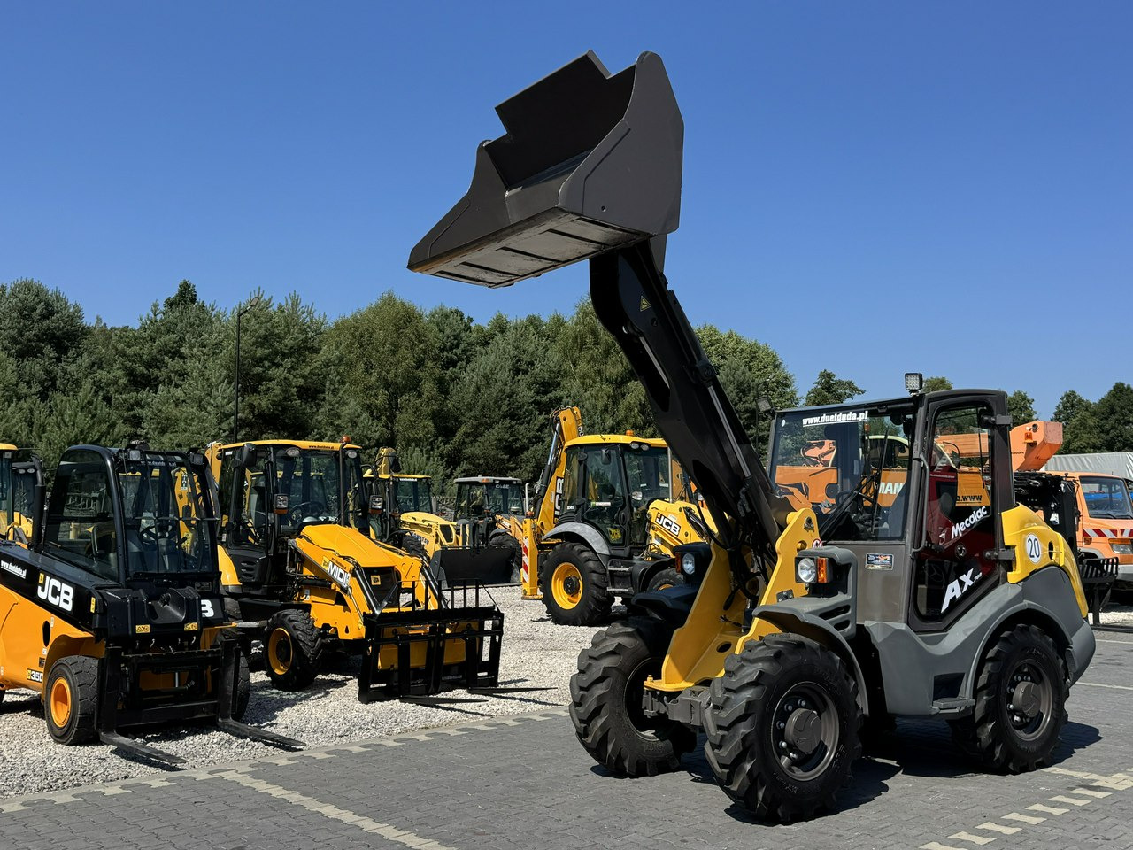 Mecalac AX 700 Szybko-Złącze Łyżka Super Stan - Utovarivač na kotačima: slika Mecalac AX 700 Szybko-Złącze Łyżka Super Stan - Utovarivač na kotačima Mecalac AX 700 Szybko-Złącze Łyżka Super Stan - Utovarivač na kotačima: slika Mecalac AX 700 Szybko-Złącze Łyżka Super Stan - Utovarivač na kotačima