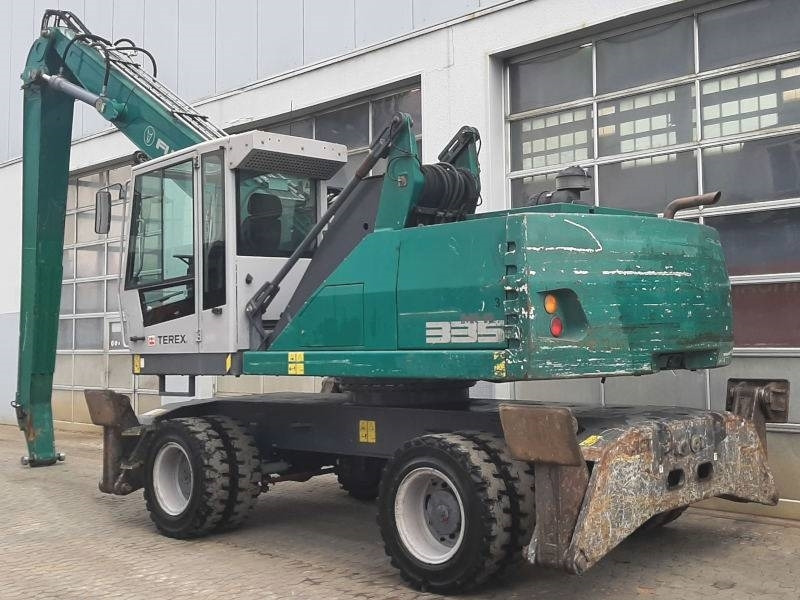 Fuchs MHL 335 E - Stroj za rukovanje otpadom: slika Fuchs MHL 335 E - Stroj za rukovanje otpadom Fuchs MHL 335 E - Stroj za rukovanje otpadom: slika Fuchs MHL 335 E - Stroj za rukovanje otpadom