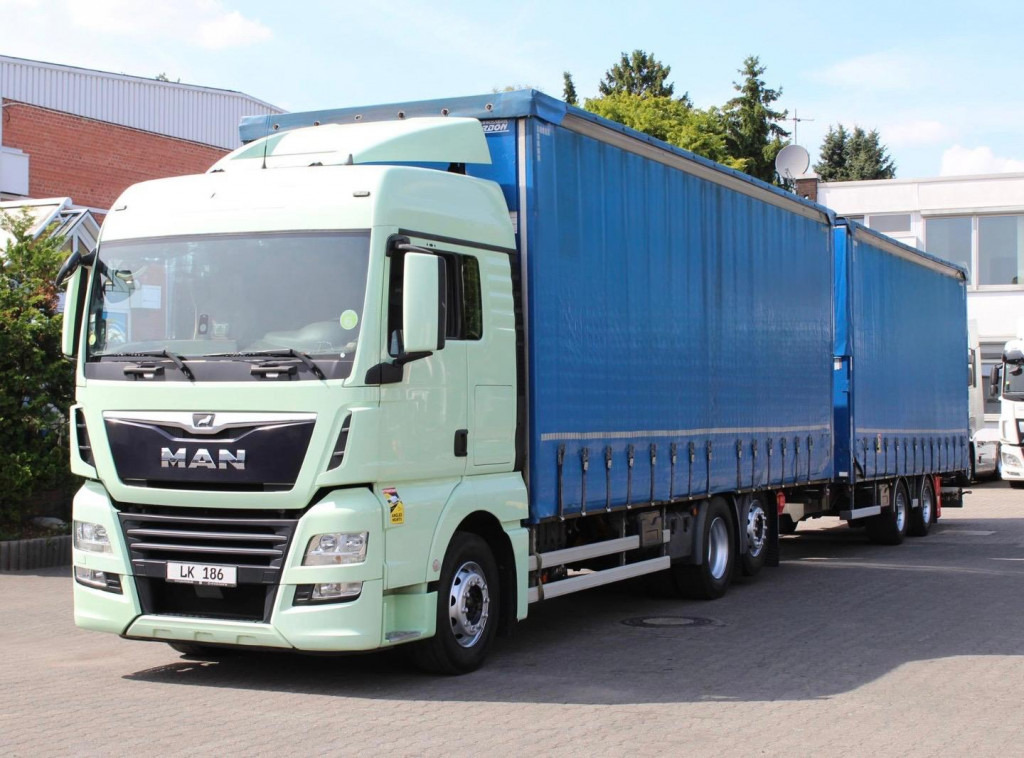MAN TGX 26.460 Retarder Jumbo-Zug 120M3 Durchlade - Kamion s ceradom: slika MAN TGX 26.460 Retarder Jumbo-Zug 120M3 Durchlade - Kamion s ceradom MAN TGX 26.460 Retarder Jumbo-Zug 120M3 Durchlade - Kamion s ceradom: slika MAN TGX 26.460 Retarder Jumbo-Zug 120M3 Durchlade - Kamion s ceradom