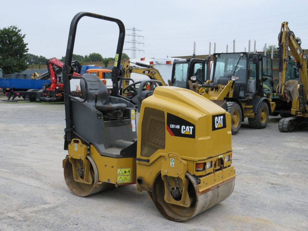 CAT Tandem-Vibrationswalze CB14 B Baumaschine - Valjak: slika CAT Tandem-Vibrationswalze CB14 B Baumaschine - Valjak CAT Tandem-Vibrationswalze CB14 B Baumaschine - Valjak: slika CAT Tandem-Vibrationswalze CB14 B Baumaschine - Valjak