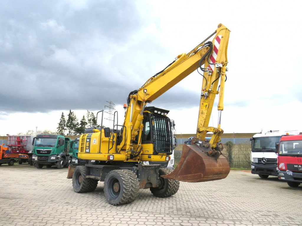 KOMATSU HANOMAG Mobilbagger PW 148 - 8 Bagger 6.824h Deutsch top - Bager na kotačima: slika KOMATSU HANOMAG Mobilbagger PW 148 - 8 Bagger 6.824h Deutsch top - Bager na kotačima KOMATSU HANOMAG Mobilbagger PW 148 - 8 Bagger 6.824h Deutsch top - Bager na kotačima: slika KOMATSU HANOMAG Mobilbagger PW 148 - 8 Bagger 6.824h Deutsch top - Bager na kotačima