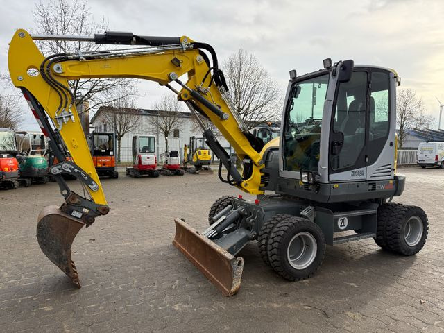 Wacker EW 65, Bj 23, 1200 BH, hydr. VA, Klima, wie neu - Bager na kotačima: slika Wacker EW 65, Bj 23, 1200 BH, hydr. VA, Klima, wie neu - Bager na kotačima Wacker EW 65, Bj 23, 1200 BH, hydr. VA, Klima, wie neu - Bager na kotačima: slika Wacker EW 65, Bj 23, 1200 BH, hydr. VA, Klima, wie neu - Bager na kotačima