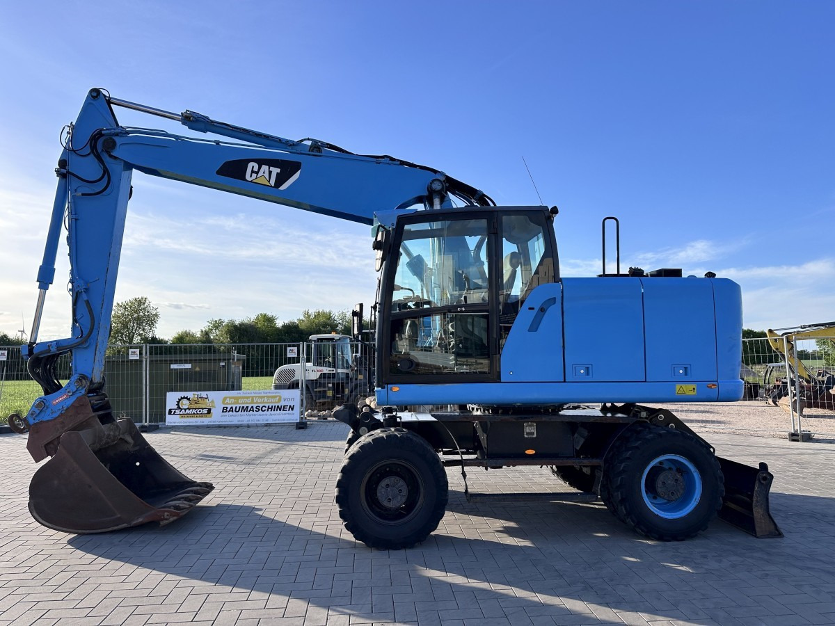 CATERPILLAR M 318 F Oil Quick OQ 65 Deutsche Maschine Top ! - Bager na kotačima: slika CATERPILLAR M 318 F Oil Quick OQ 65 Deutsche Maschine Top ! - Bager na kotačima CATERPILLAR M 318 F Oil Quick OQ 65 Deutsche Maschine Top ! - Bager na kotačima: slika CATERPILLAR M 318 F Oil Quick OQ 65 Deutsche Maschine Top ! - Bager na kotačima