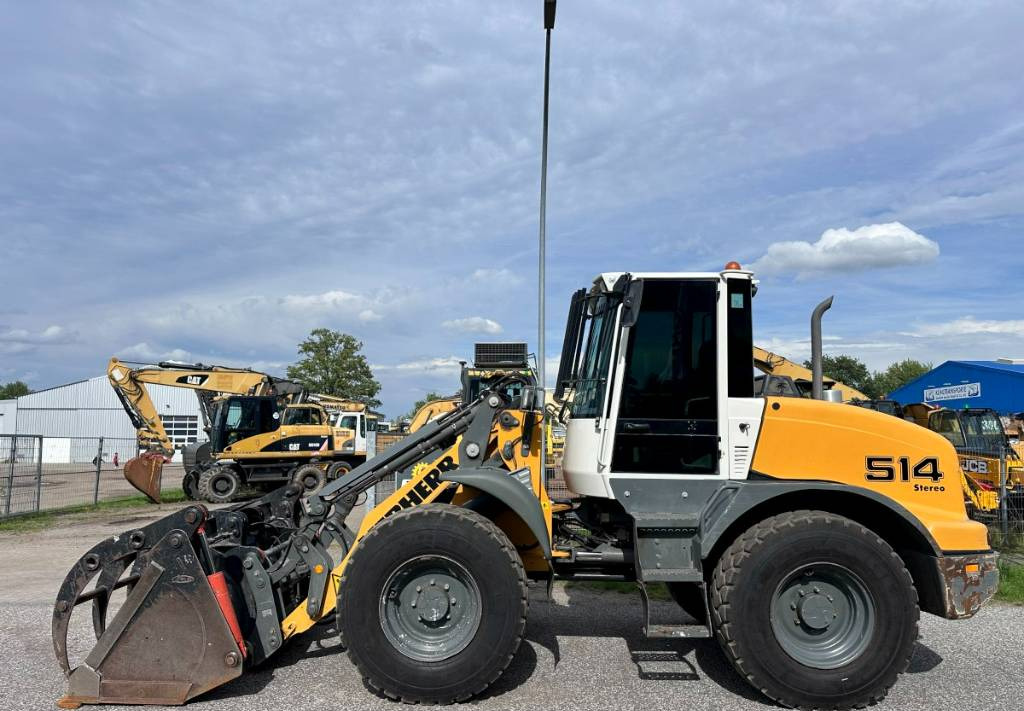 Liebherr L 514 Stereo +30 Kmh Klima 3er Kreis Greifschaufel - Utovarivač na kotačima: slika Liebherr L 514 Stereo +30 Kmh Klima 3er Kreis Greifschaufel - Utovarivač na kotačima Liebherr L 514 Stereo +30 Kmh Klima 3er Kreis Greifschaufel - Utovarivač na kotačima: slika Liebherr L 514 Stereo +30 Kmh Klima 3er Kreis Greifschaufel - Utovarivač na kotačima