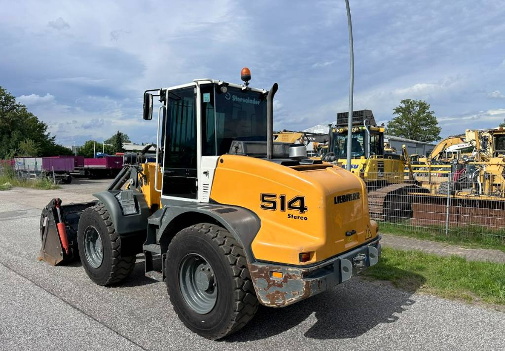 Liebherr L 514 Stereo +30 Kmh Klima 3er Kreis Greifschaufel - Utovarivač na kotačima: slika Liebherr L 514 Stereo +30 Kmh Klima 3er Kreis Greifschaufel - Utovarivač na kotačima Liebherr L 514 Stereo +30 Kmh Klima 3er Kreis Greifschaufel - Utovarivač na kotačima: slika Liebherr L 514 Stereo +30 Kmh Klima 3er Kreis Greifschaufel - Utovarivač na kotačima