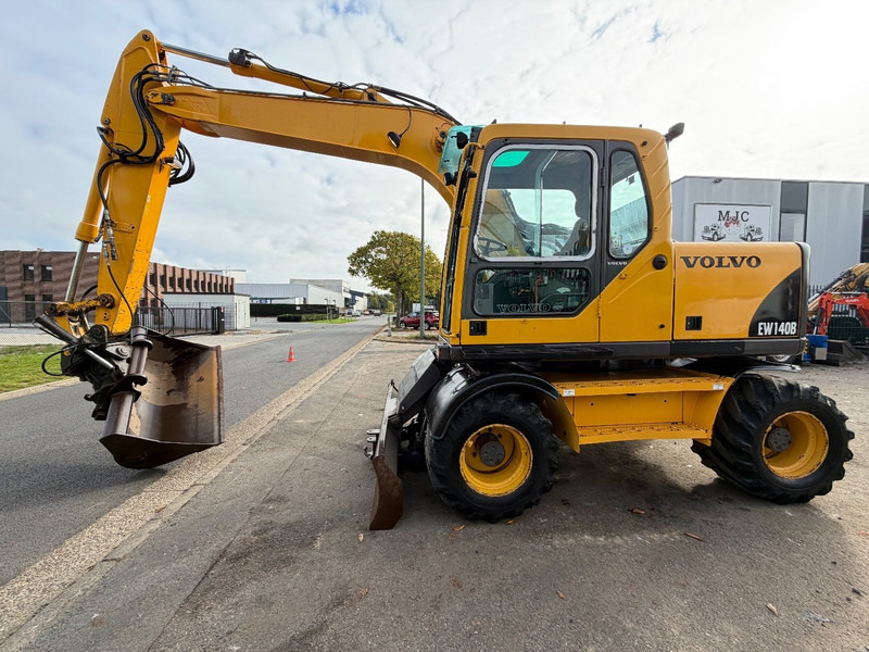 Volvo EW 140 B *FULL HYDR* - BLADE - 10.485h - TILT BUCKET - CE - NL MACHINE - GOOD CONDITION - Bager na kotačima: slika Volvo EW 140 B *FULL HYDR* - BLADE - 10.485h - TILT BUCKET - CE - NL MACHINE - GOOD CONDITION - Bager na kotačima Volvo EW 140 B *FULL HYDR* - BLADE - 10.485h - TILT BUCKET - CE - NL MACHINE - GOOD CONDITION - Bager na kotačima: slika Volvo EW 140 B *FULL HYDR* - BLADE - 10.485h - TILT BUCKET - CE - NL MACHINE - GOOD CONDITION - Bager na kotačima