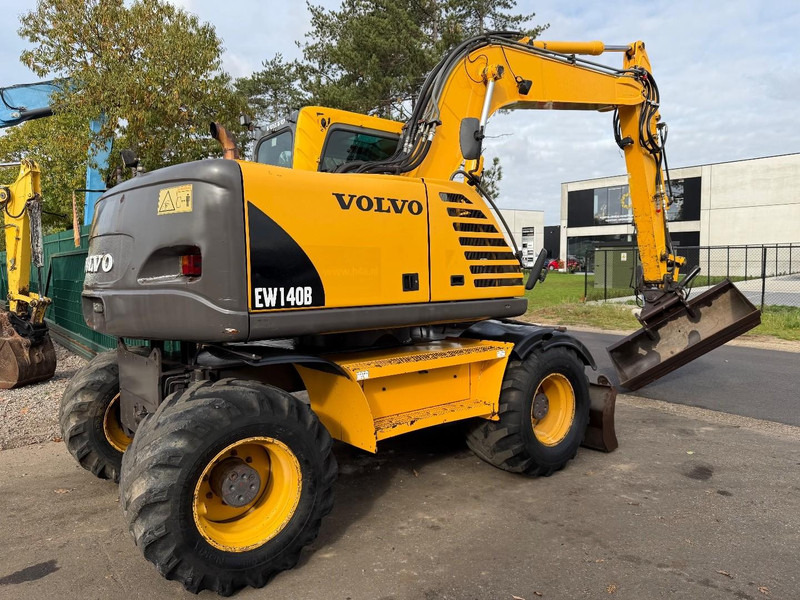 Volvo EW 140 B *FULL HYDR* - BLADE - 10.485h - TILT BUCKET - CE - NL MACHINE - GOOD CONDITION - Bager na kotačima: slika Volvo EW 140 B *FULL HYDR* - BLADE - 10.485h - TILT BUCKET - CE - NL MACHINE - GOOD CONDITION - Bager na kotačima Volvo EW 140 B *FULL HYDR* - BLADE - 10.485h - TILT BUCKET - CE - NL MACHINE - GOOD CONDITION - Bager na kotačima: slika Volvo EW 140 B *FULL HYDR* - BLADE - 10.485h - TILT BUCKET - CE - NL MACHINE - GOOD CONDITION - Bager na kotačima