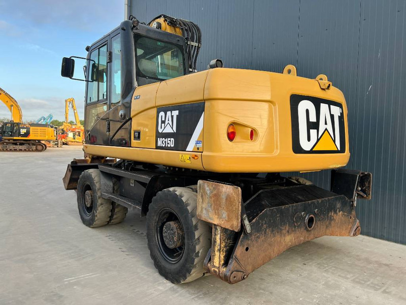 Cat M315D - Bager na kotačima: slika Cat M315D - Bager na kotačima Cat M315D - Bager na kotačima: slika Cat M315D - Bager na kotačima