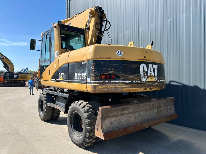 Cat M316C - Bager na kotačima: slika Cat M316C - Bager na kotačima Cat M316C - Bager na kotačima: slika Cat M316C - Bager na kotačima