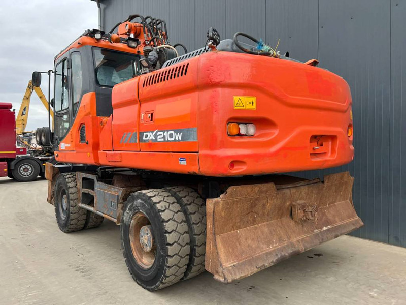 Doosan DX210W - Bager na kotačima: slika Doosan DX210W - Bager na kotačima Doosan DX210W - Bager na kotačima: slika Doosan DX210W - Bager na kotačima
