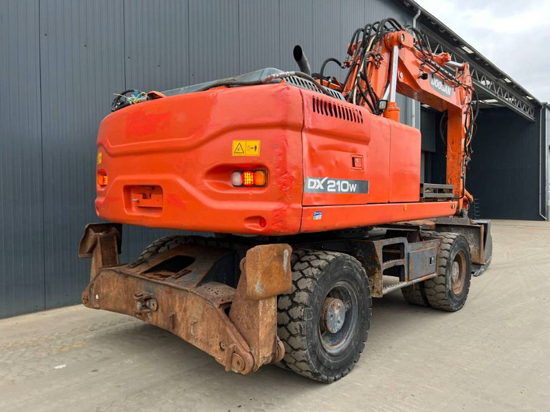 Doosan DX210W - Bager na kotačima: slika Doosan DX210W - Bager na kotačima Doosan DX210W - Bager na kotačima: slika Doosan DX210W - Bager na kotačima
