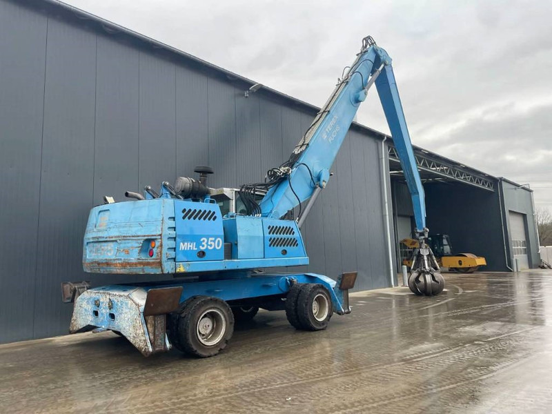 Fuchs MHL350 - Stroj za rukovanje otpadom: slika Fuchs MHL350 - Stroj za rukovanje otpadom Fuchs MHL350 - Stroj za rukovanje otpadom: slika Fuchs MHL350 - Stroj za rukovanje otpadom