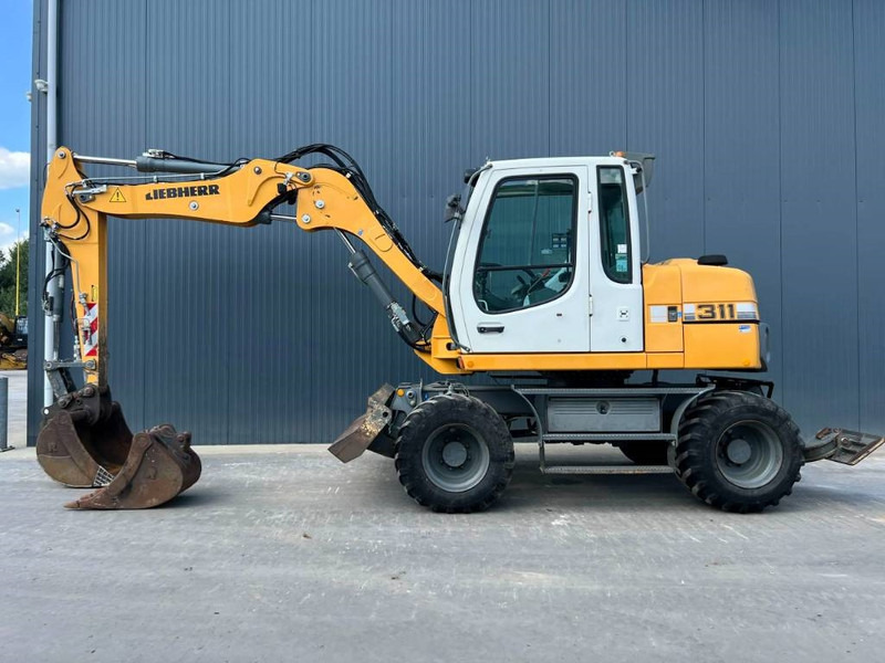 Liebherr A311 Litronic - Bager na kotačima: slika Liebherr A311 Litronic - Bager na kotačima Liebherr A311 Litronic - Bager na kotačima: slika Liebherr A311 Litronic - Bager na kotačima