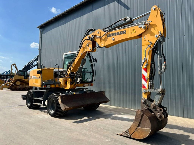 Liebherr A311 Litronic - Bager na kotačima: slika Liebherr A311 Litronic - Bager na kotačima Liebherr A311 Litronic - Bager na kotačima: slika Liebherr A311 Litronic - Bager na kotačima