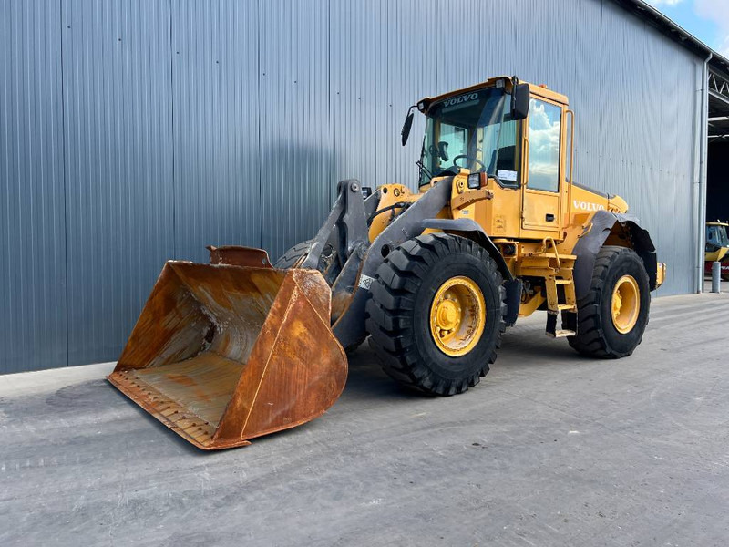 Volvo L60E - Utovarivač na kotačima: slika Volvo L60E - Utovarivač na kotačima Volvo L60E - Utovarivač na kotačima: slika Volvo L60E - Utovarivač na kotačima