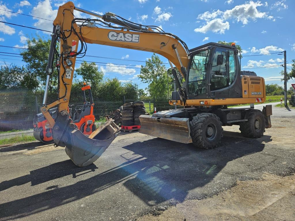 CASE WX 145 - Bager na kotačima: slika CASE WX 145 - Bager na kotačima CASE WX 145 - Bager na kotačima: slika CASE WX 145 - Bager na kotačima