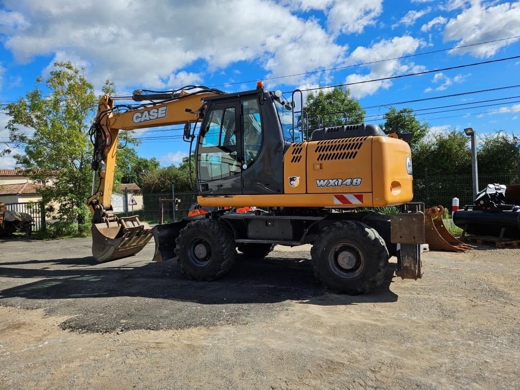 CASE WX 145 - Bager na kotačima: slika CASE WX 145 - Bager na kotačima CASE WX 145 - Bager na kotačima: slika CASE WX 145 - Bager na kotačima