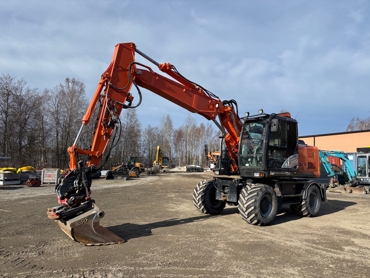 Hitachi ZX140W-5B - Bager: slika Hitachi ZX140W-5B - Bager Hitachi ZX140W-5B - Bager: slika Hitachi ZX140W-5B - Bager