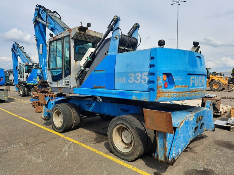 Fuchs MHL 335 - Stroj za rukovanje otpadom: slika Fuchs MHL 335 - Stroj za rukovanje otpadom Fuchs MHL 335 - Stroj za rukovanje otpadom: slika Fuchs MHL 335 - Stroj za rukovanje otpadom