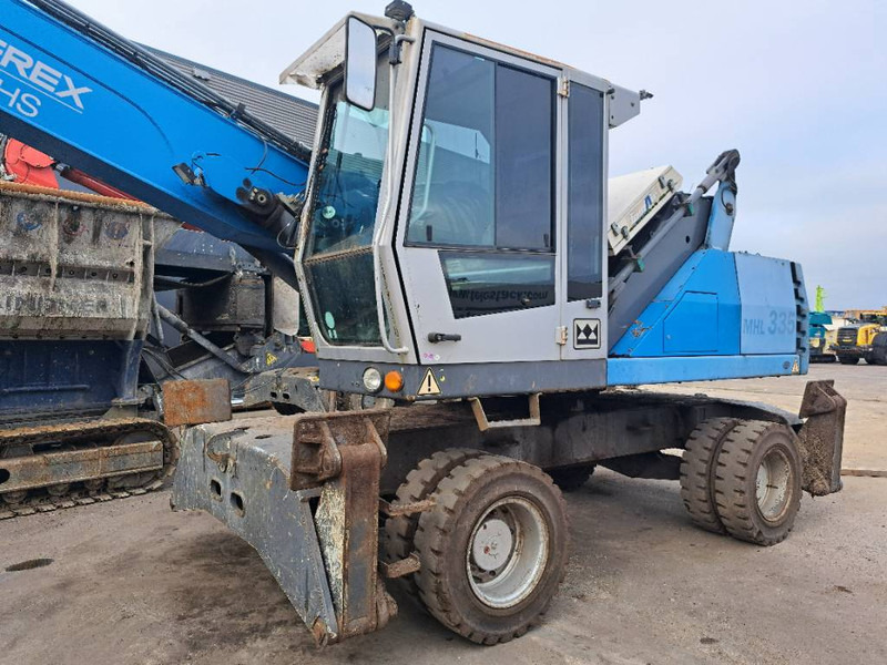 Fuchs MHL 335 - Stroj za rukovanje otpadom: slika Fuchs MHL 335 - Stroj za rukovanje otpadom Fuchs MHL 335 - Stroj za rukovanje otpadom: slika Fuchs MHL 335 - Stroj za rukovanje otpadom