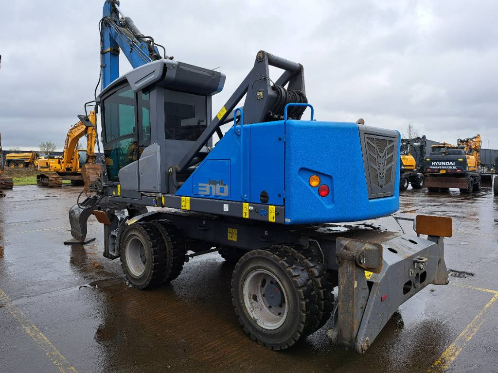 Fuchs MHL310F + Grapple - Stroj za rukovanje otpadom: slika Fuchs MHL310F + Grapple - Stroj za rukovanje otpadom Fuchs MHL310F + Grapple - Stroj za rukovanje otpadom: slika Fuchs MHL310F + Grapple - Stroj za rukovanje otpadom