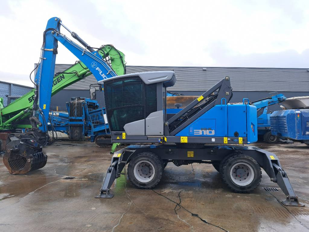Fuchs MHL310F + Grapple - Stroj za rukovanje otpadom: slika Fuchs MHL310F + Grapple - Stroj za rukovanje otpadom Fuchs MHL310F + Grapple - Stroj za rukovanje otpadom: slika Fuchs MHL310F + Grapple - Stroj za rukovanje otpadom