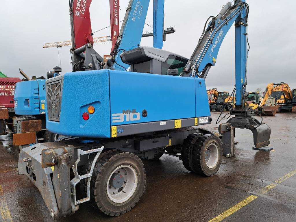 Fuchs MHL310F + Grapple - Stroj za rukovanje otpadom: slika Fuchs MHL310F + Grapple - Stroj za rukovanje otpadom Fuchs MHL310F + Grapple - Stroj za rukovanje otpadom: slika Fuchs MHL310F + Grapple - Stroj za rukovanje otpadom