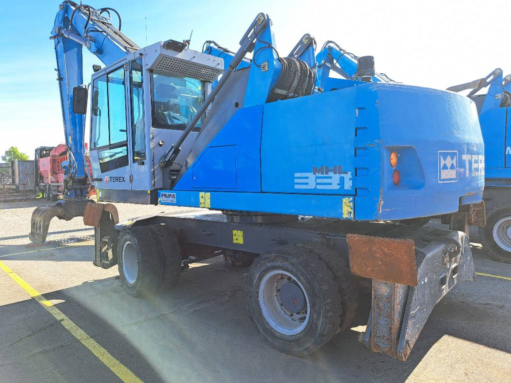 Fuchs MHL331E + Grapple - Stroj za rukovanje otpadom: slika Fuchs MHL331E + Grapple - Stroj za rukovanje otpadom Fuchs MHL331E + Grapple - Stroj za rukovanje otpadom: slika Fuchs MHL331E + Grapple - Stroj za rukovanje otpadom